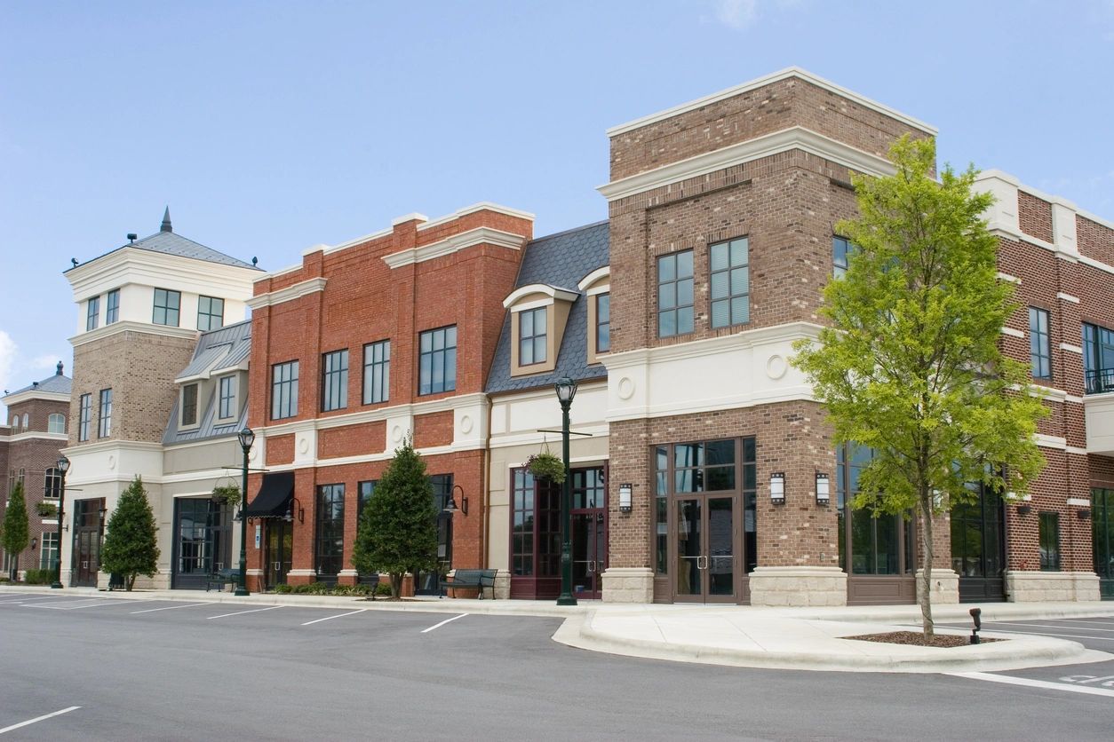 A row of two story brick stores
